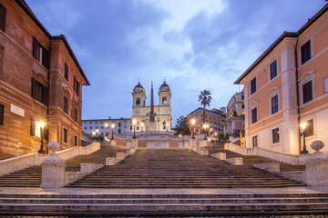 View over a beautiful historic Roman city. At one of the sights, with old buildings in an urban flair. Morning sunrise at the Spanish Steps Scalinata di Trinità dei Monti, Rome, Italy