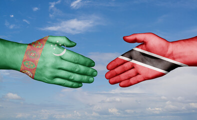 Trinidad and Tobago and Turkmenistan country handshaking with flags, consensus concept international co-operation illustration