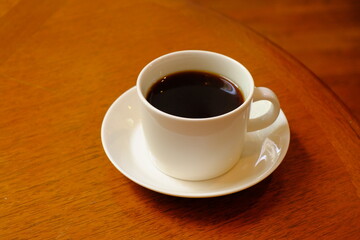cup of coffee on wooden table