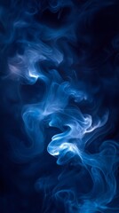 Obraz premium Blue smoke forming abstract shapes over black background