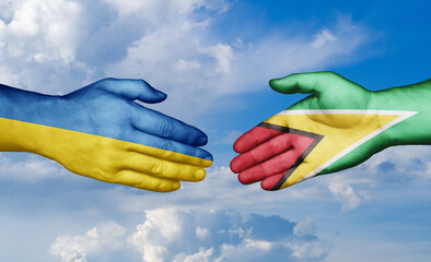 Ukraine and Guyana country handshaking with flags, consensus concept international co-operation illustration