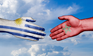 Morocco and Uruguay country handshaking with flags, consensus concept international co-operation...