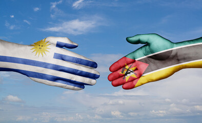 Mozambique and Uruguay country handshaking with flags, consensus concept international co-operation illustration