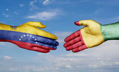 Republic of Guinea and Venezuela country handshaking with flags, consensus concept international co-operation illustration © iuneWind