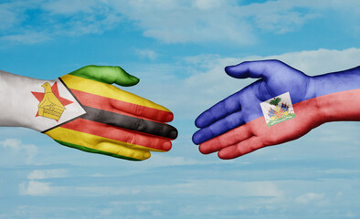 Haiti and Zimbabwe country handshaking with flags, consensus concept international co-operation illustration