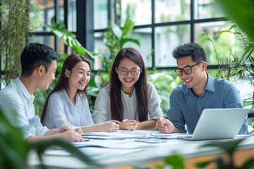 Happy marketing team working together at meeting room in office. Colleagues, teamwork concept