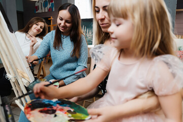 Artistic moments shared among friends and family in a cozy studio