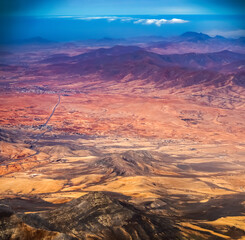 Top view through the clouds on Fuerteventura islands landscapes.
