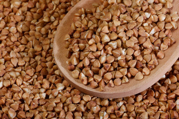 Buckwheat and wooden spoon