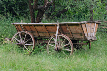 Traditional country cart in nature background. Vintage wooden transport. © Ga_Na