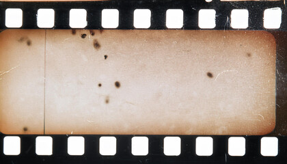 Blank grained film strip texture background with heavy grain, dust and fingerprints overlay for post production photo