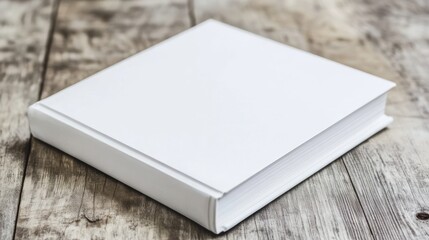 Fototapeta premium Blank White Book on Wooden Table