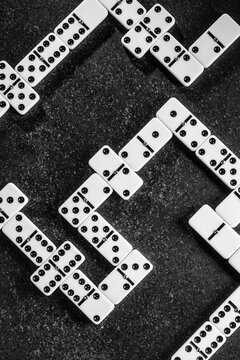 Classic dominoes on a textured surface evoke nostalgia
