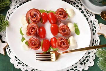 Creative antipasti skewers with mozzarella, cherry tomato and rose shaped sausage