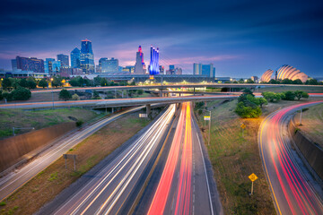 Kansas City, Missouri, USA. Cityscape image of Kansas City skyline with busy highway leading to the city at autumn sunrise.