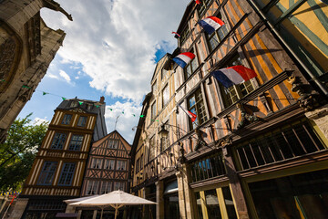 ROUEN, NORMANDY, FRANCE: Church Saint Maclou gargoyle and timber-framed houses, next to the house that leans, best-known timber-framed house in Rouen, 17th century