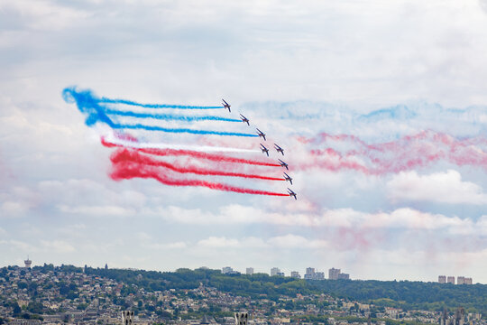 ROUEN, NORMANDY, FRANCE: "Patrouille de France",  French Acrobatic Patrol, performing aerobatic figures above the city of Rouen, Armada 2023, tall ships gathering