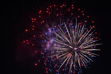 Fireworks on the dark sky background at festival.