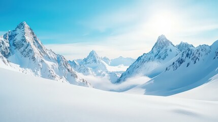 Obraz premium A breathtaking view of a snowy mountain landscape under a clear blue sky, showcasing serene peaks and a peaceful, untouched wilderness. Perfect for travel enthusiasts.