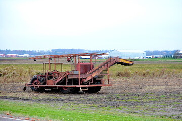 Fototapeta premium Farm tractor and equipment in the Holland Marsh in Ontario, Canada. Holland Marsh is a key source of food grown in the Greenbelt in Ontario.
