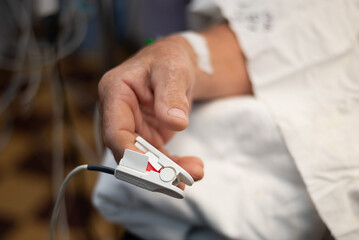 patient's hand during surgery in hospital