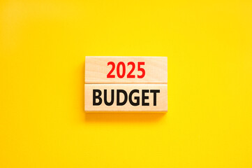 Planning 2025 budget new year symbol. Concept words 2025 Budget on beautiful wooden blocks. Beautiful yellow background. Business 2025 budget new year concept. Copy space.