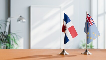 FLAGS OF DOMINICAN REPUBLIC AND TUVALU ON TABLE