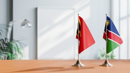 FLAGS OF EAST TIMOR AND NAMIBIA ON TABLE