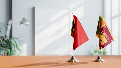 FLAGS OF EAST TIMOR AND SRI LANKA ON TABLE