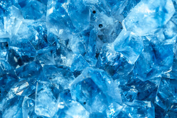 Blue Crystal Mineral Stone. Gems. Mineral crystals in the natural environment. Texture of precious and semiprecious stones. Seamless background with copy space colored shiny surface of precious stones