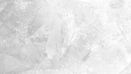 The light-colored cement wall has cracks.