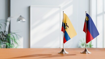 FLAGS OF ECUADOR AND LIECHTENSTEIN ON TABLE