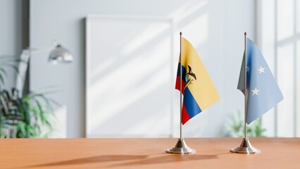 FLAGS OF ECUADOR AND MICRONESIA ON TABLE