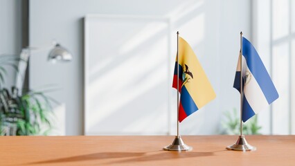 FLAGS OF ECUADOR AND NICARAGUA ON TABLE