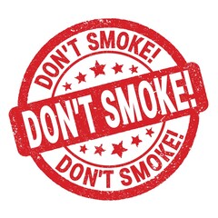 DON'T SMOKE! text written on red round stamp sign.