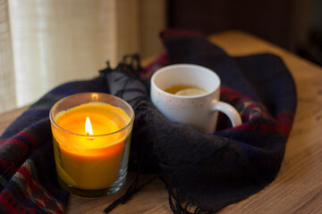 Cup of hot tea with lemon and coffin scarf.