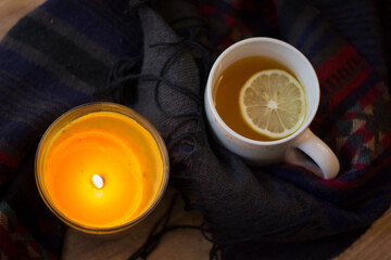 Cup of hot tea with lemon and coffin scarf.