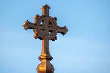 Christian cross is on the roof of the church