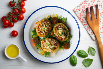 Baked potatoes stuffed with meat and baked in the oven. Top view table with  decorations.