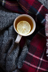 cup of hot tea with lemon and  coffin scarf.
