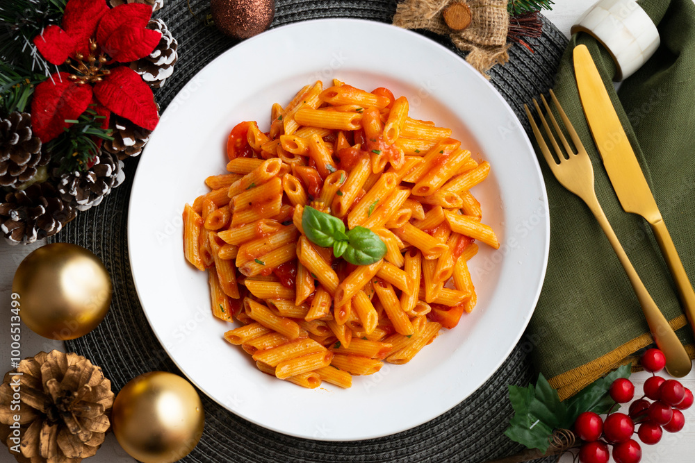 Wall mural macaroni with tomato and basil aroma. top view table with christmas decorations.