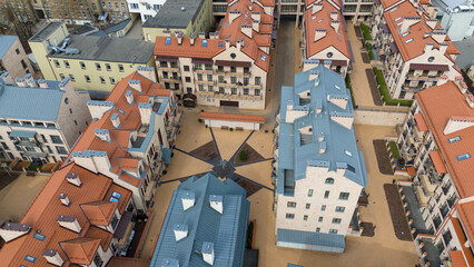 Aerial View of Modern Residential Complex with Red and Blue Roofs