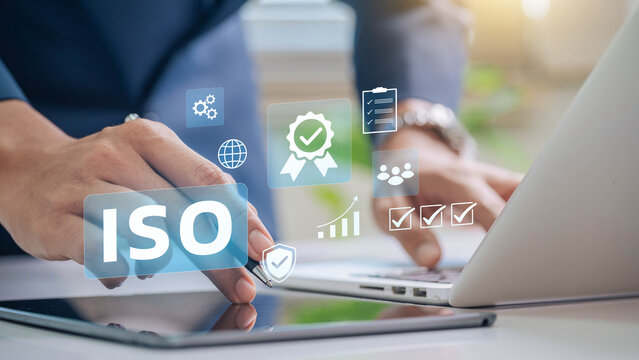 ISO certification and quality management concept. Business professional reviewing ISO certification standards with digital icons representing quality control, management, and compliance processes.