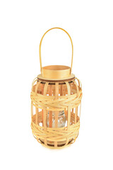 Hand lantern woven from wicker with candle isolated on white.