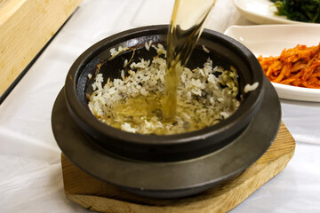 Korea food. hot pot scorched rice water