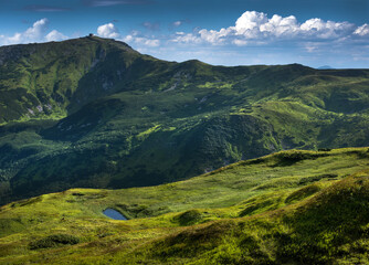 Pip Ivan mountain with observatory silhouette, alpine height and high mountain lake, Chornohirsky...