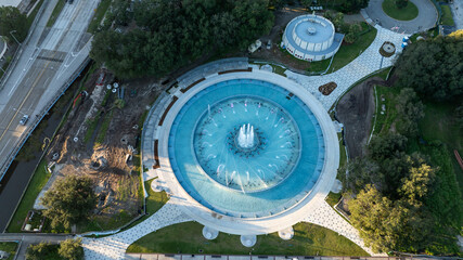 Aerial view of Friendship Fountain in Jacksonville, Florida, highlighting its circular design, water jets, and surrounding park area in Duval County.