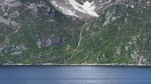 Stjern&oslash;ya, Stierdn&aacute;, Alta Municipality, Finnmark, Norway - river L&aacute;ttu mountain slope formed by glacier melted snow flows into valley as waterfall