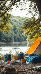A serene outdoor camping scene with a vibrant orange tent, cooking utensils, and a picturesque forest backdrop by the water.