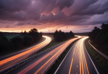 Fototapeta premium Long exposure of a busy highway at night with blurred car lights creating a swirling pattern